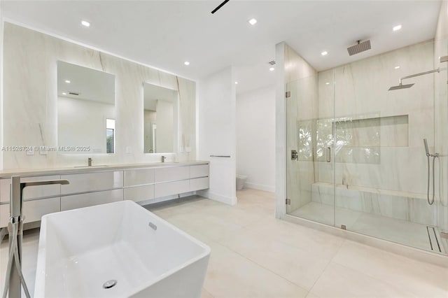 full bathroom with toilet, independent shower and bath, tile patterned flooring, and vanity