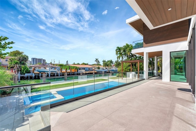 view of pool featuring tennis court