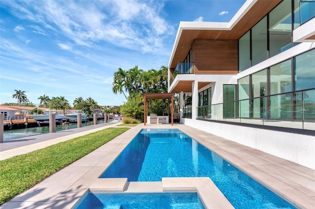 view of pool featuring a patio and a water view