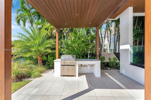 view of patio with an outdoor kitchen and area for grilling