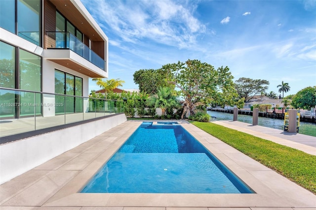 view of pool with a water view