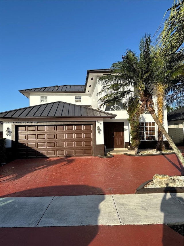 view of front of home with a garage