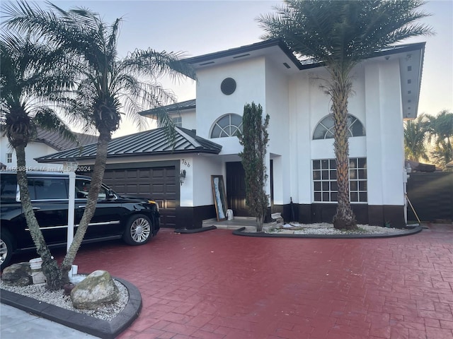 view of front of property with a garage