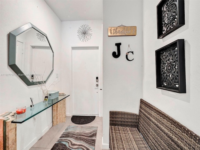 entrance foyer featuring light tile floors