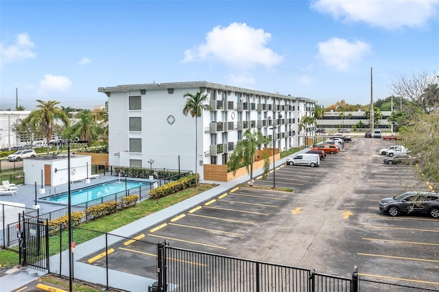 view of building exterior featuring a community pool