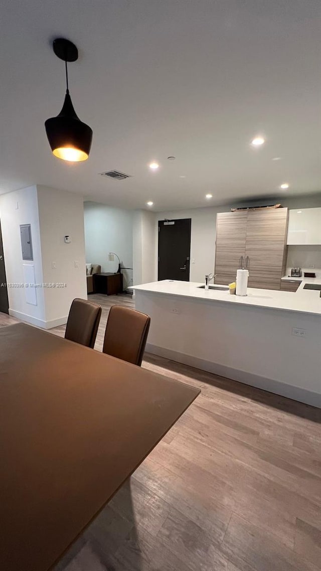 interior space featuring sink and light wood-type flooring