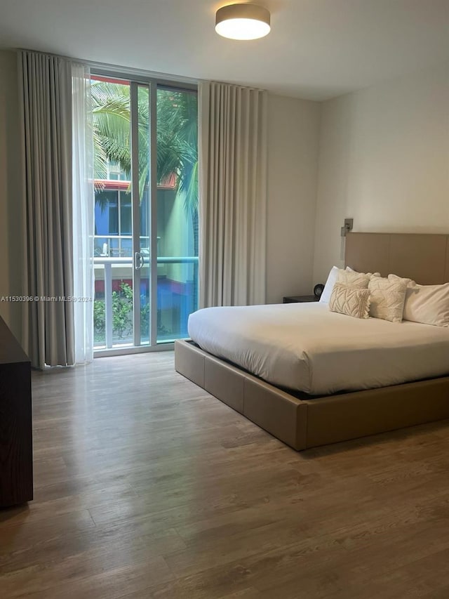 bedroom featuring wood-type flooring