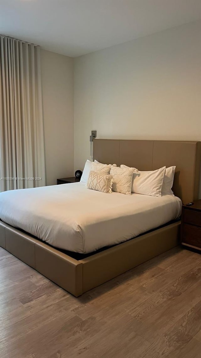 bedroom featuring hardwood / wood-style flooring