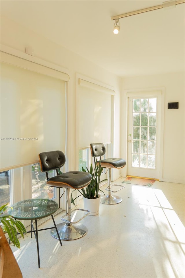 sitting room featuring track lighting