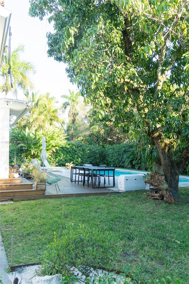 view of yard featuring a swimming pool side deck