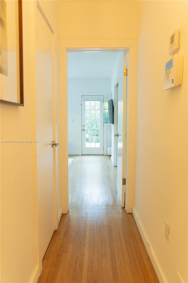 corridor featuring hardwood / wood-style floors