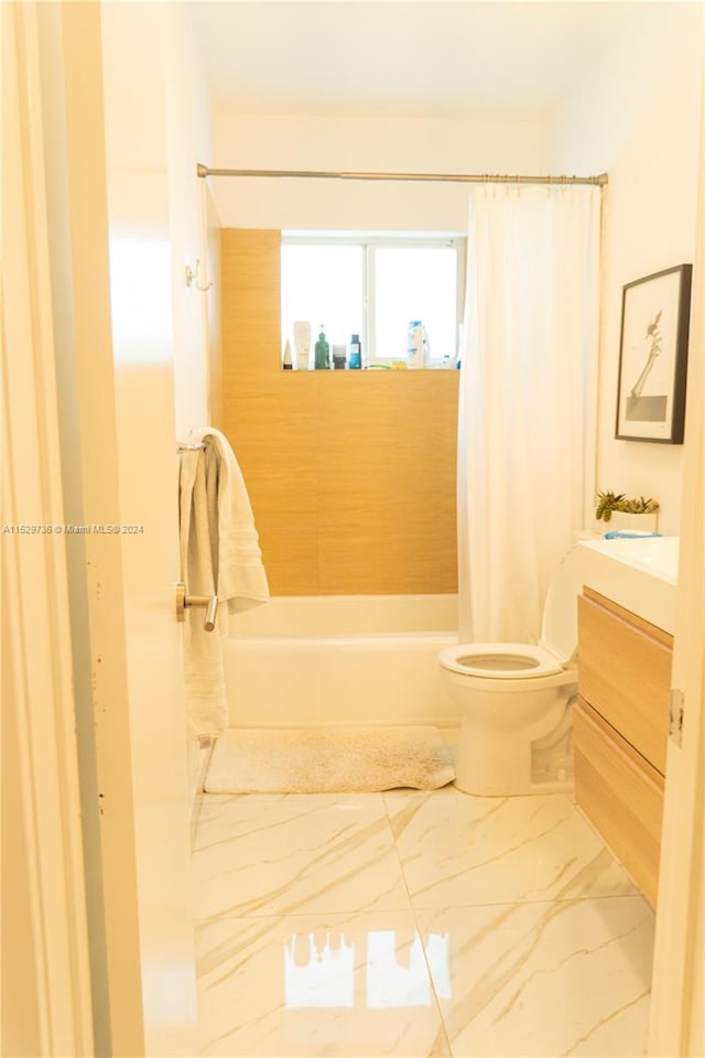 full bathroom featuring tile flooring, shower / tub combo, vanity, and toilet