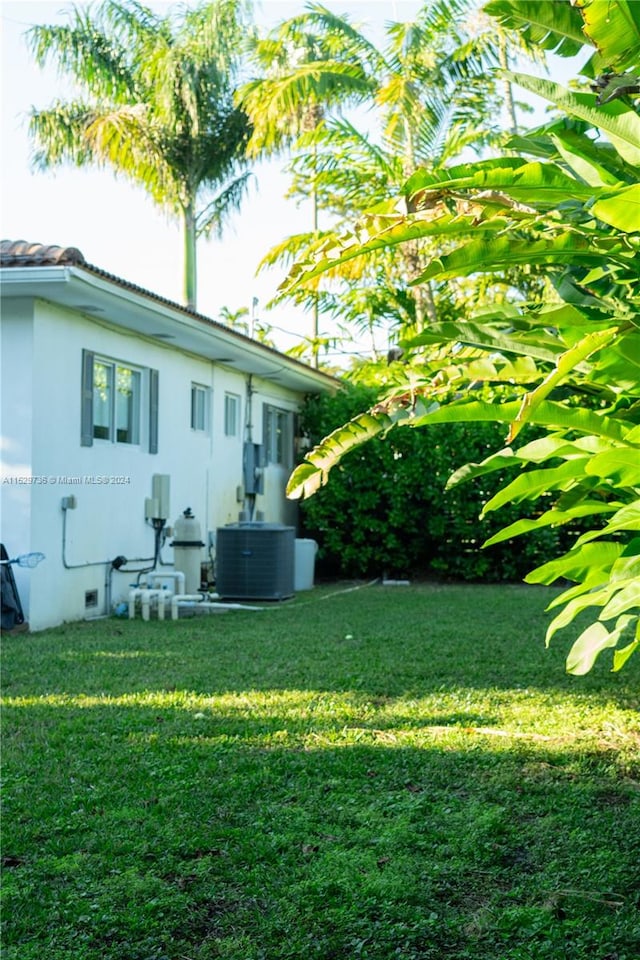 view of yard featuring central air condition unit