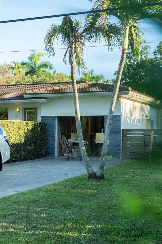 rear view of house with a yard