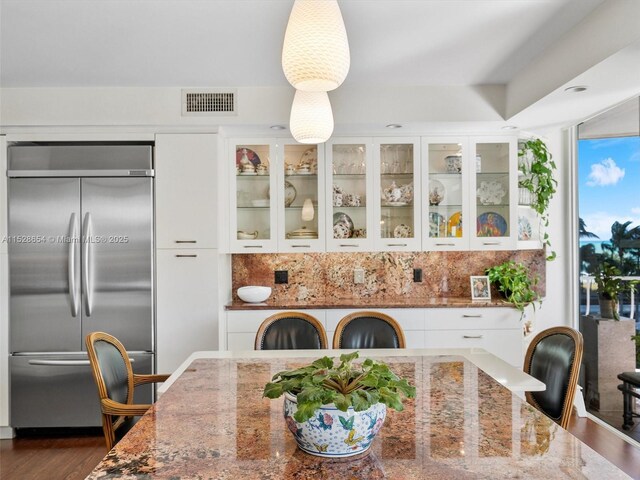 dining room with dark wood-type flooring