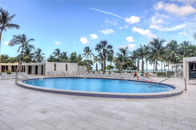 view of pool featuring a patio