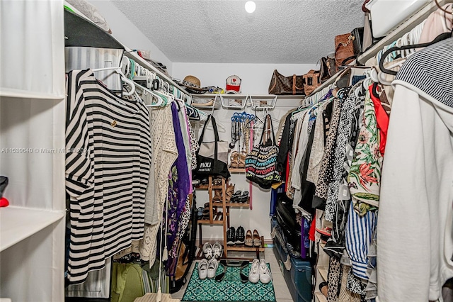 spacious closet with tile floors