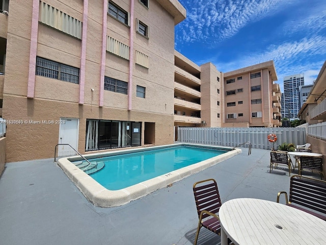 view of pool with a patio