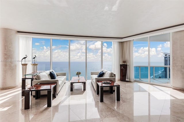 living room featuring a water view, a wealth of natural light, and expansive windows