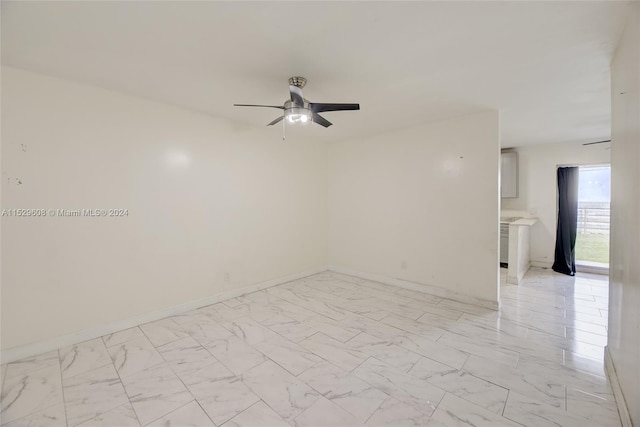 unfurnished room featuring light tile floors and ceiling fan