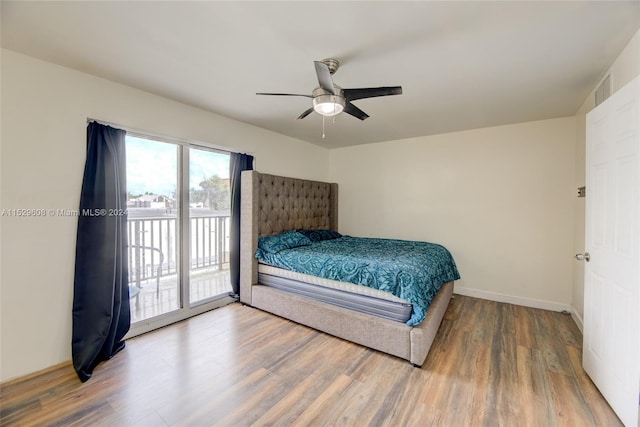 bedroom featuring access to outside, ceiling fan, and light wood-type flooring