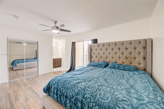 bedroom with light hardwood / wood-style floors, a closet, ceiling fan, and ensuite bathroom