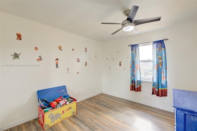 rec room featuring ceiling fan and hardwood / wood-style flooring