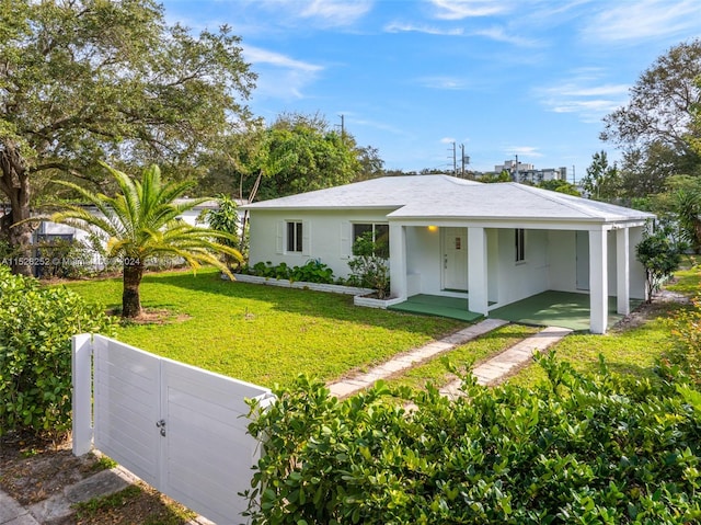 ranch-style home with a front lawn