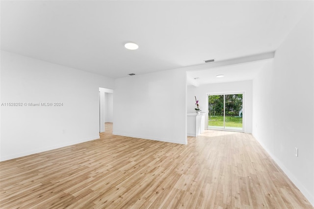 unfurnished room with light wood-type flooring