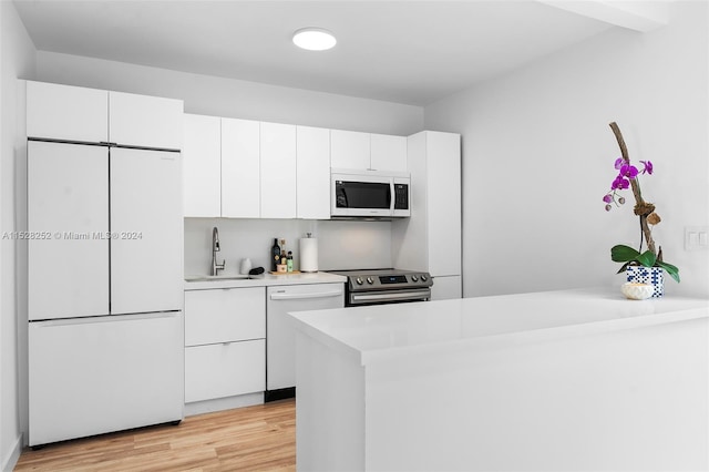 kitchen featuring sink, light hardwood / wood-style flooring, white cabinetry, and stainless steel appliances