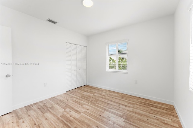 spare room featuring light wood-type flooring