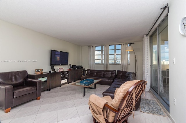 tiled living room with a textured ceiling