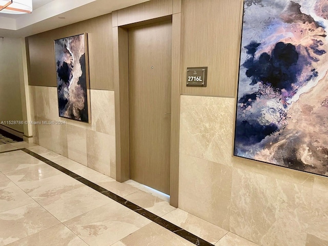 hallway with light tile floors