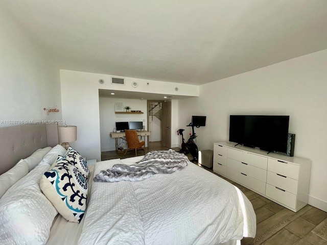 bedroom with wood-type flooring