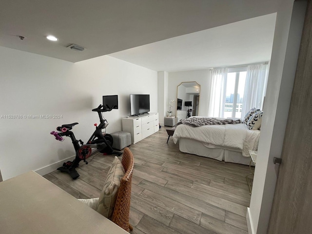 bedroom with light wood-type flooring