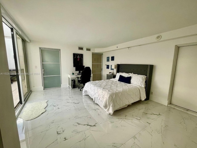 bedroom featuring light tile floors