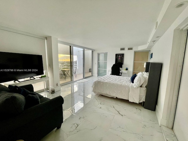 bedroom with light tile floors, access to outside, and floor to ceiling windows