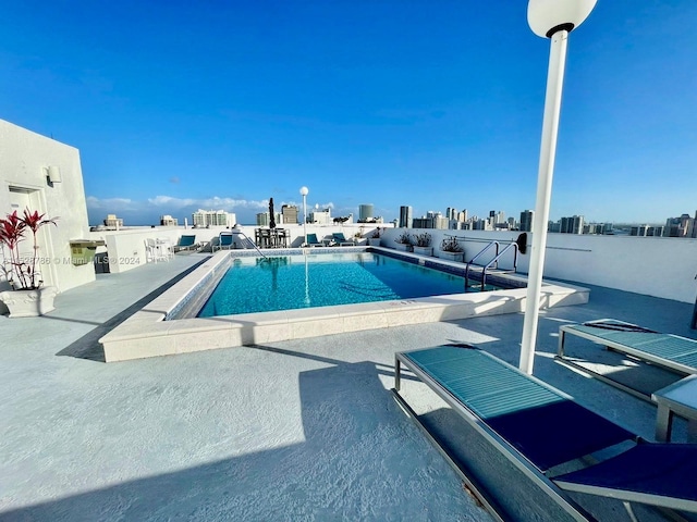 view of pool featuring a patio area