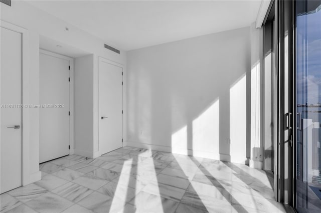 view of tiled spare room