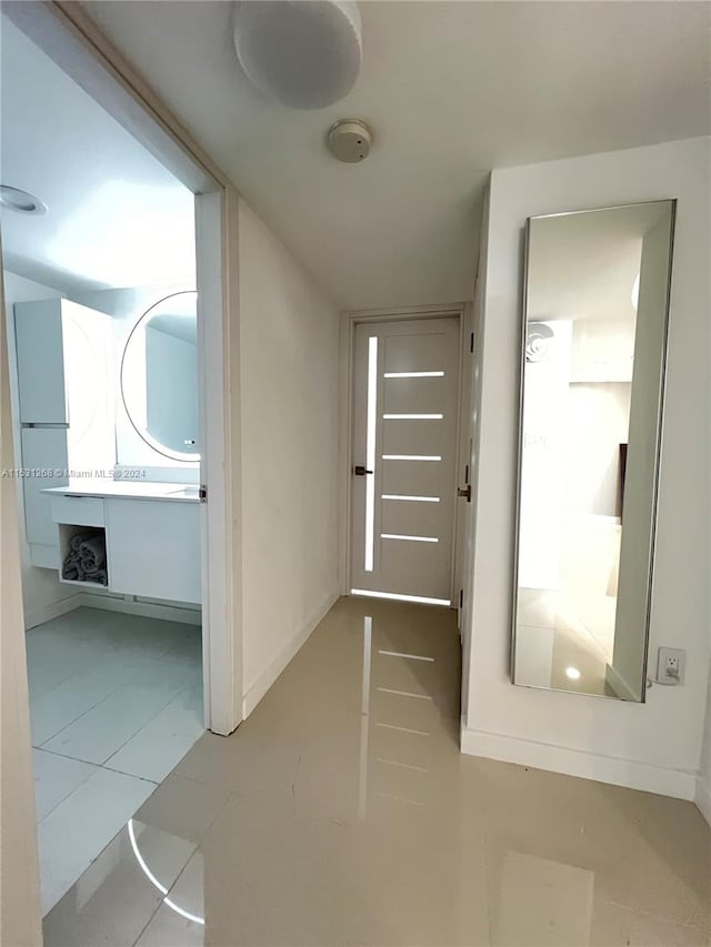 hallway with tile flooring