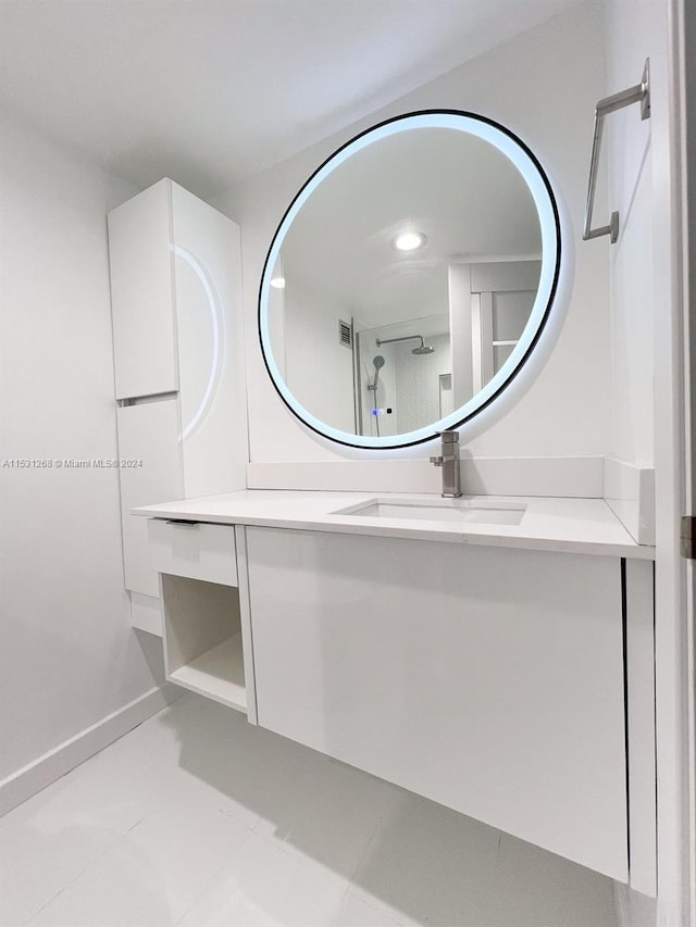 bathroom with tile flooring and vanity