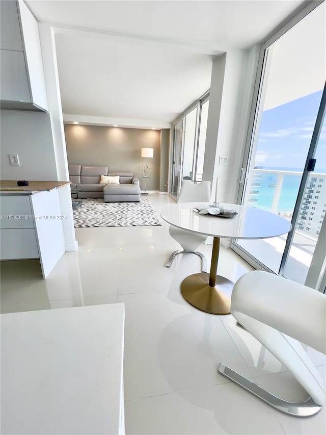 kitchen featuring tile flooring and a wall of windows