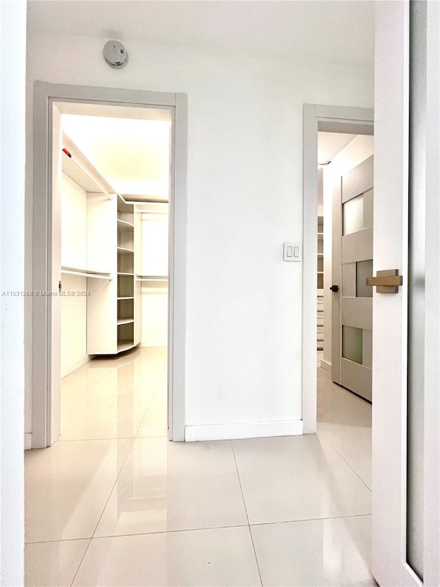 hallway with light tile floors