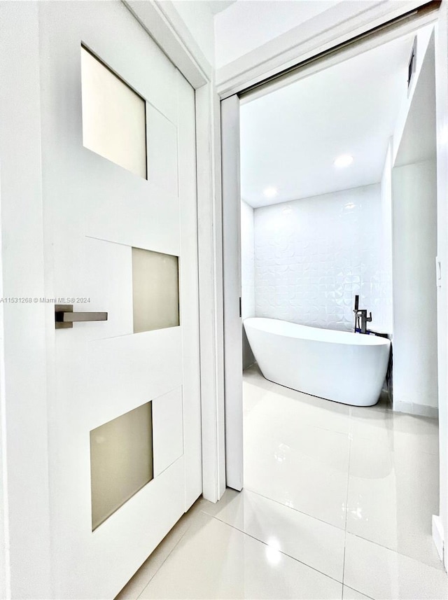 bathroom featuring tile flooring and tile walls