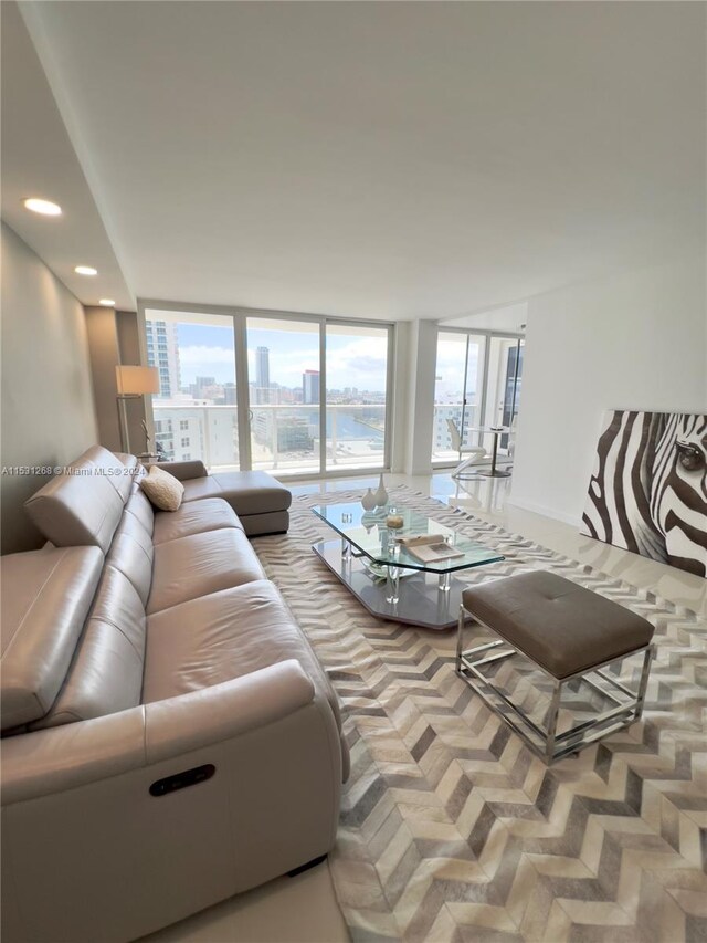 living room with expansive windows and parquet floors