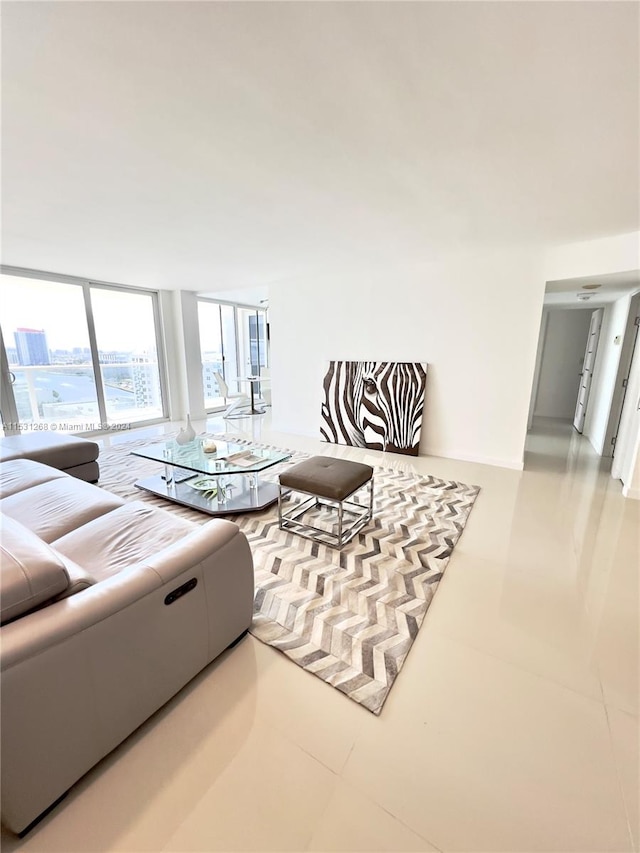 living room featuring tile flooring and floor to ceiling windows