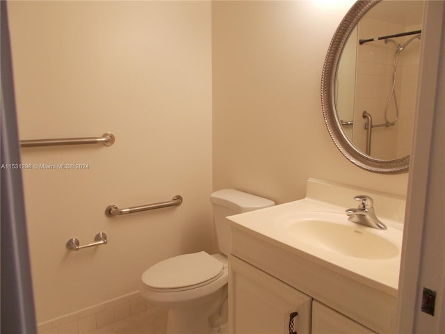 bathroom with toilet and vanity