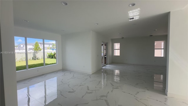 unfurnished room with light tile floors