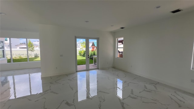 spare room featuring light tile flooring