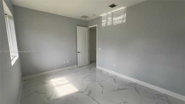 view of tiled spare room